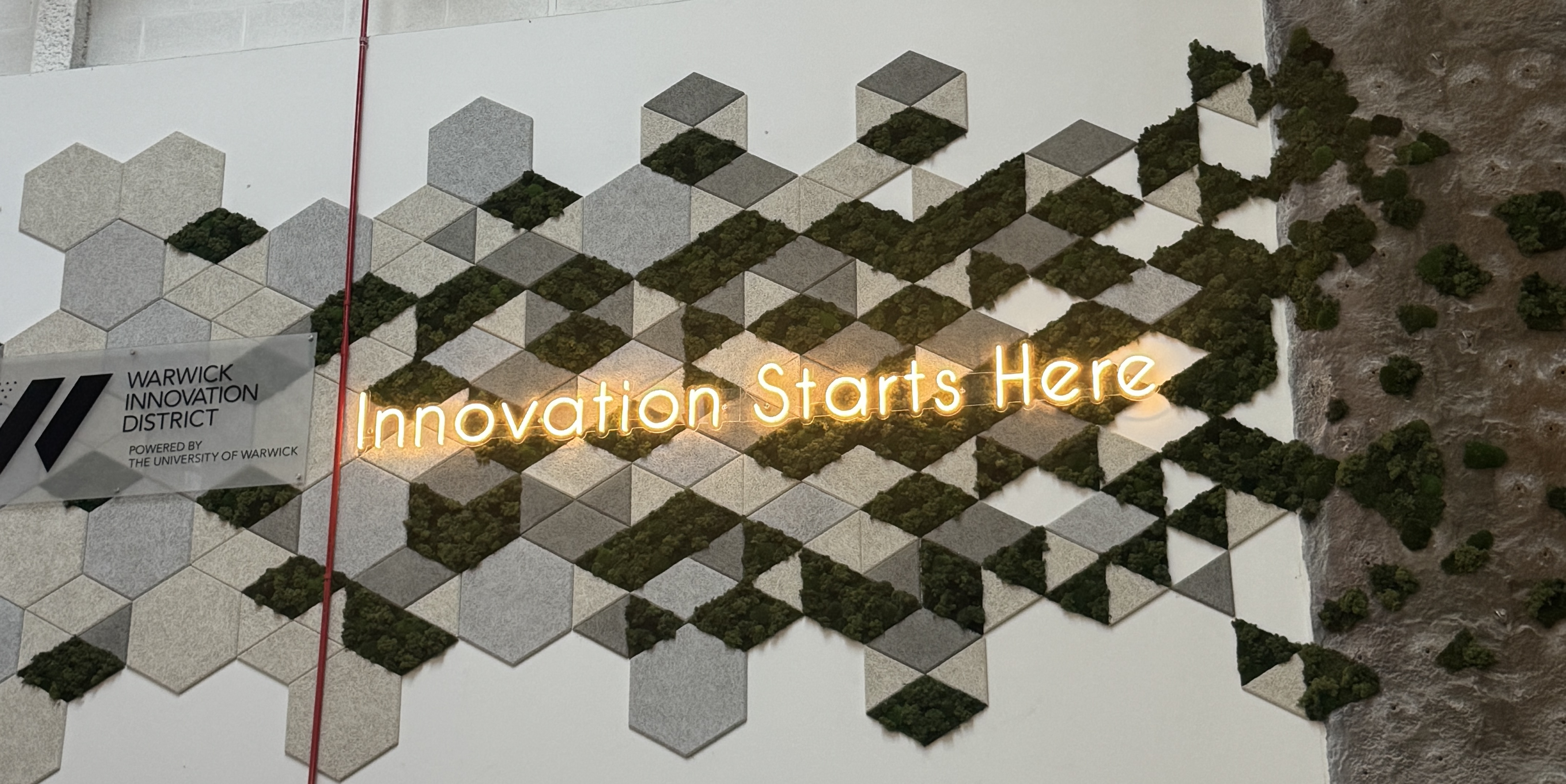 Innovation Starts Here sign at the Warwick Innovation District