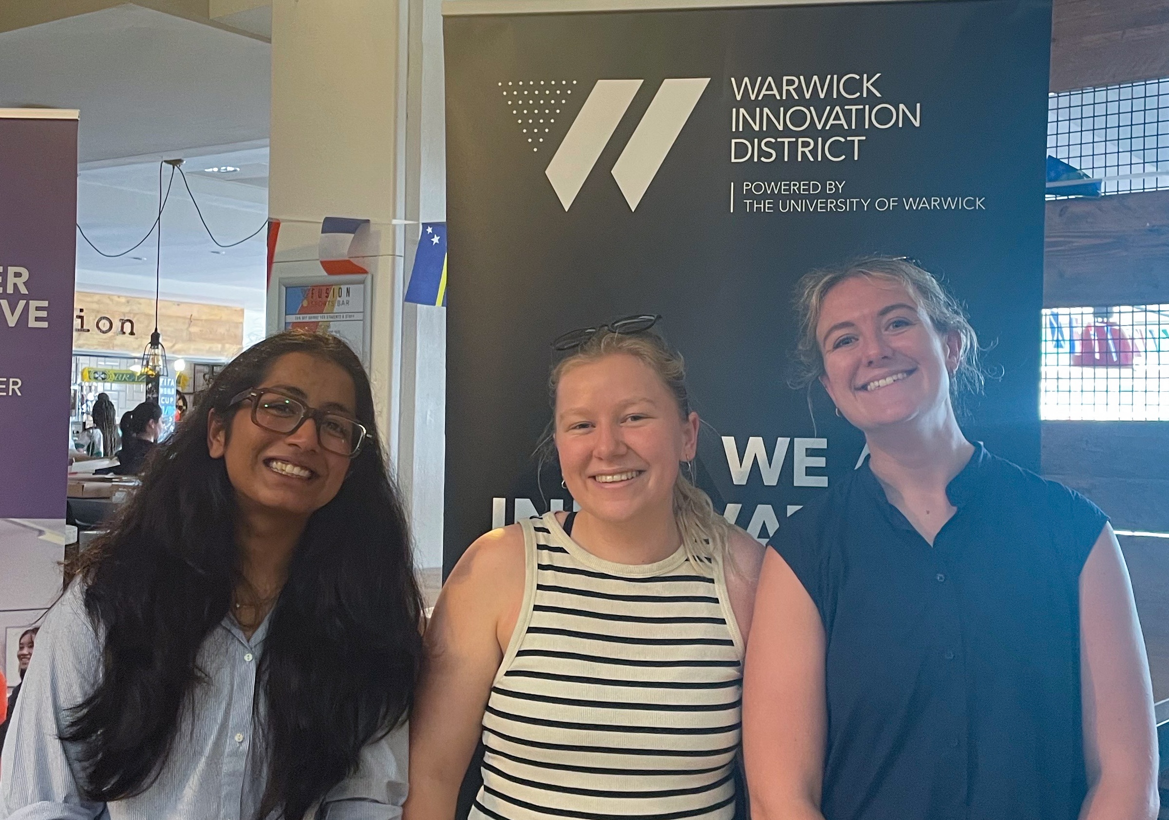 Three interns standing together at the Warwick Innovation District